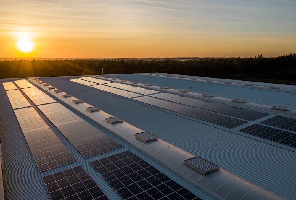 Sun shining on community solar panels